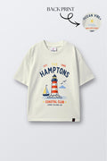 Off-white comfort tee with colorful lighthouse and 'Champions' front graphic