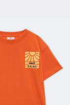 Orange kids' tee front chest graphic with 'Sun Shine' sun icon