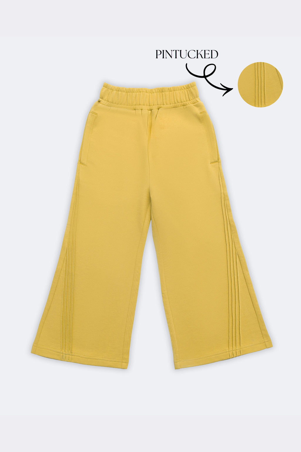 Yellow palazzo pants with slant pintuck detailing on both sides, elastic waistband
