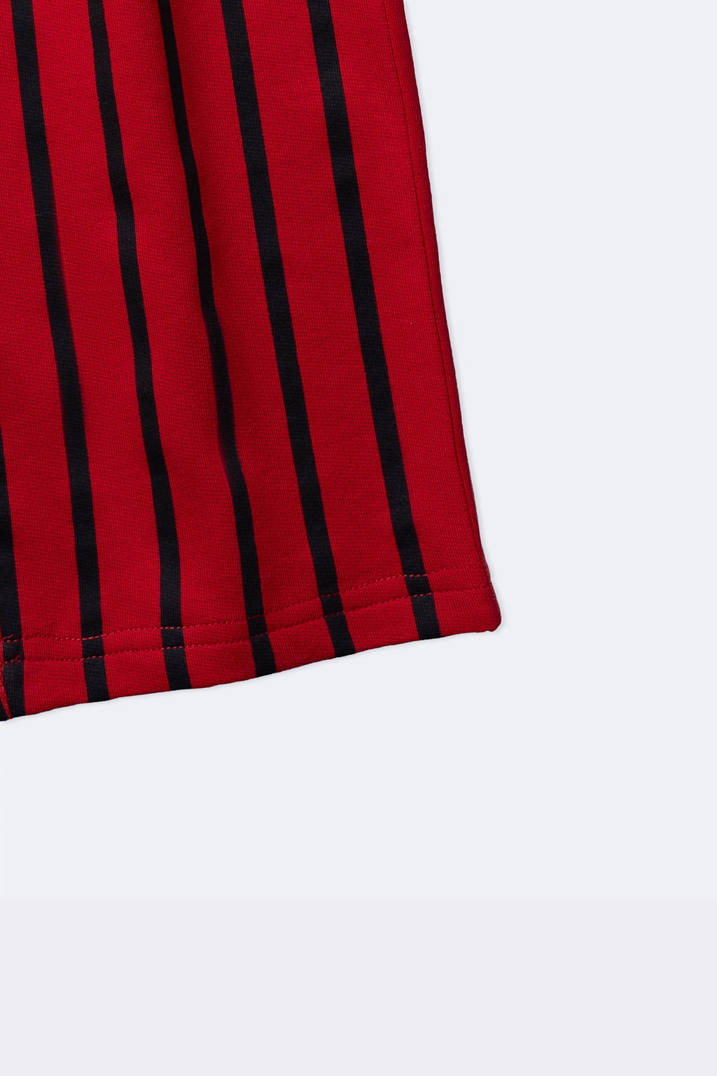 Red and black striped track pants hem with elastic cuff