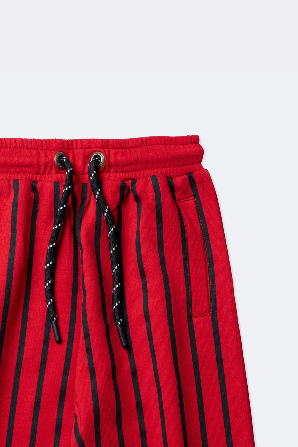 Red and black striped track pants with drawstring and side pocket
