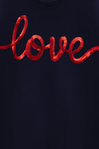 Navy T-shirt close-up of red 'love' lettering graphic