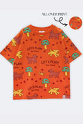Orange kids all-over print comfort tee with repeated “Let’s Play!” animal graphics