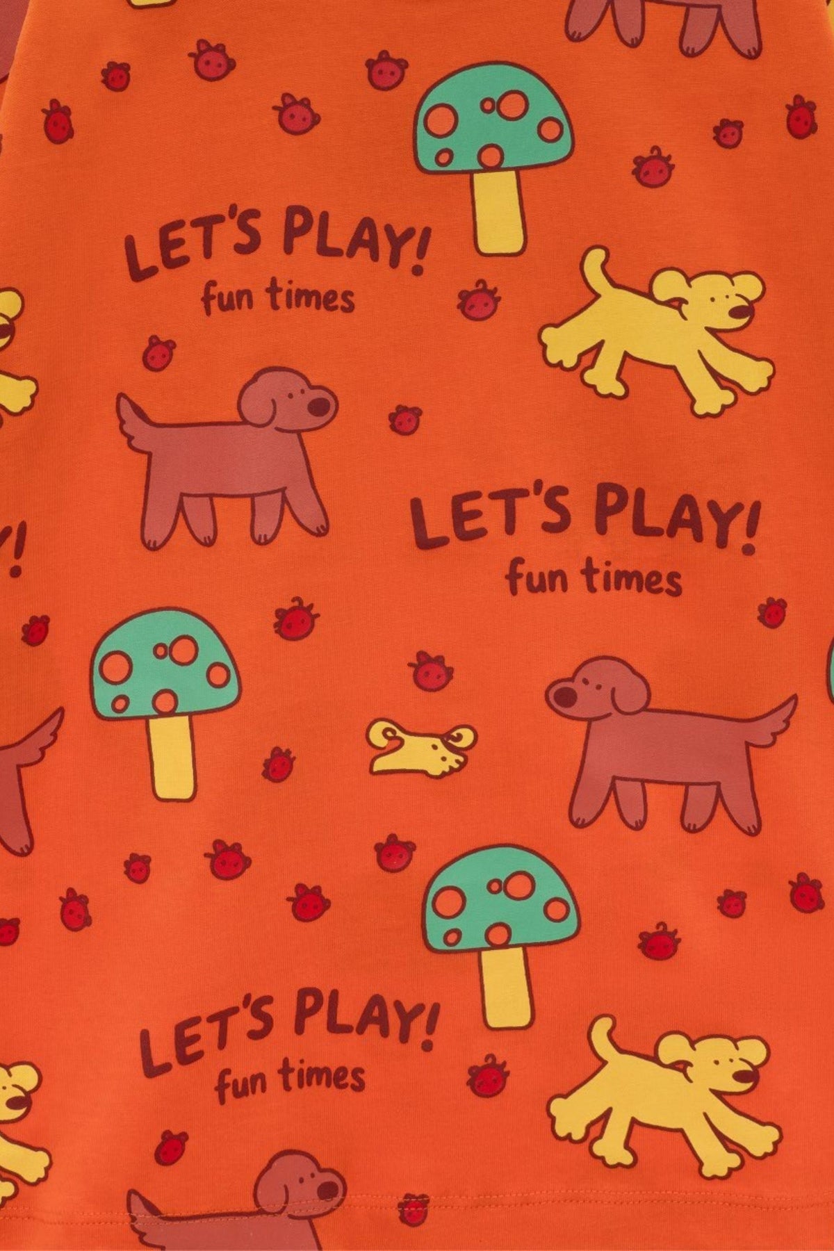 Orange tee close-up pattern: “Let’s Play! fun times” with dogs, bugs, and mushrooms