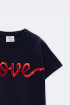 Navy T-shirt with red 'love' script on chest, angled view