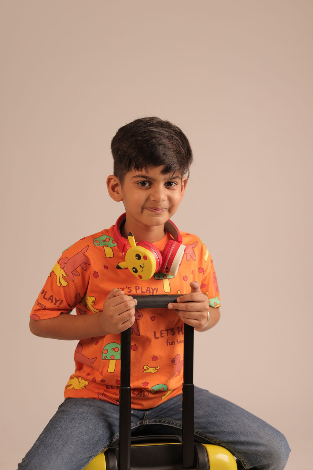 Orange kids all-over print comfort tee on child, short sleeves and round neck