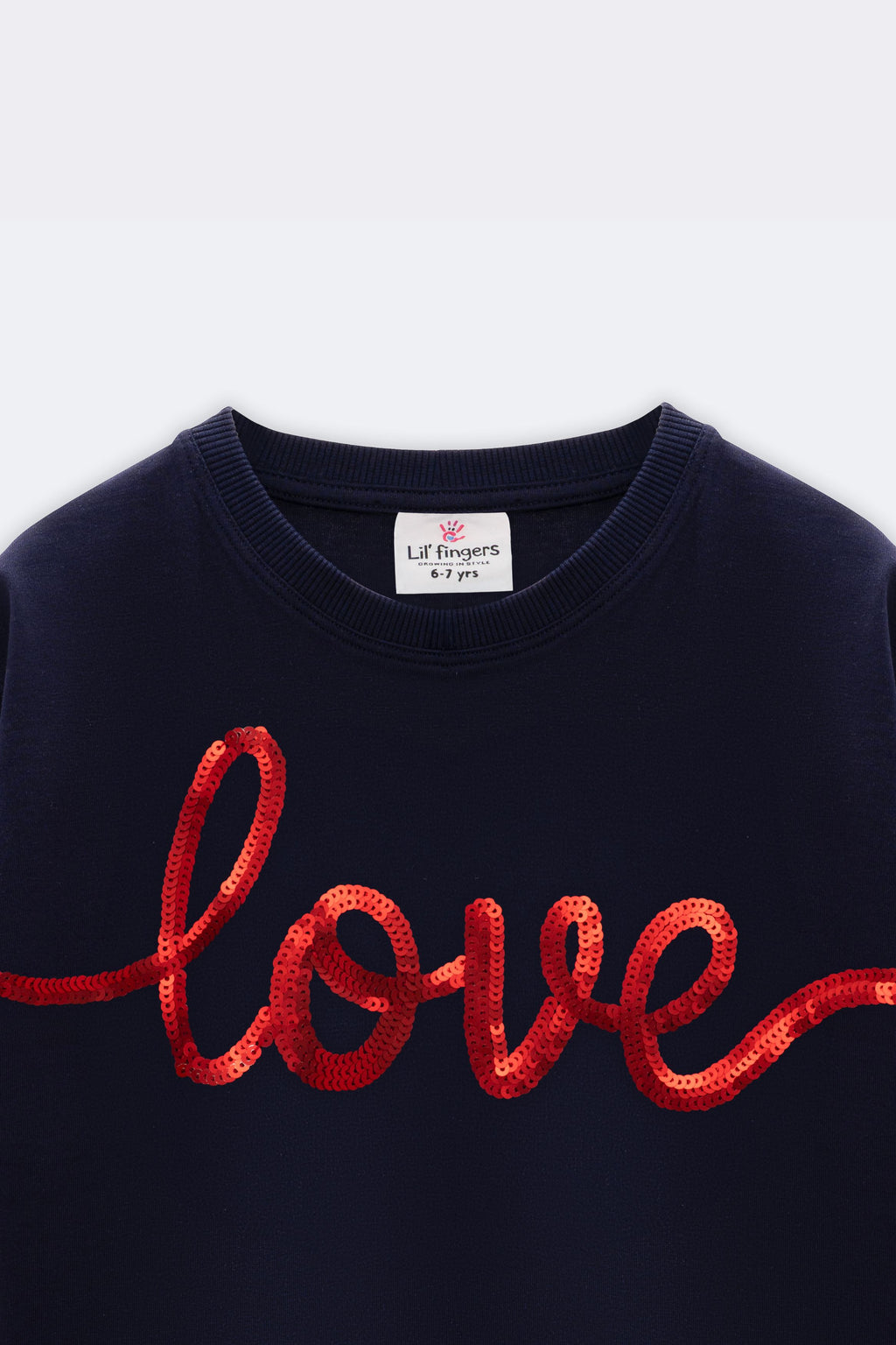 Navy crewneck T-shirt with red glitter 'love' script, close-up
