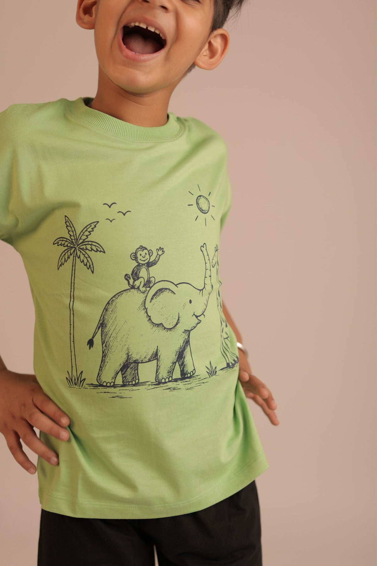 Lime green kids comfort tee with chest elephant and palm tree line-art