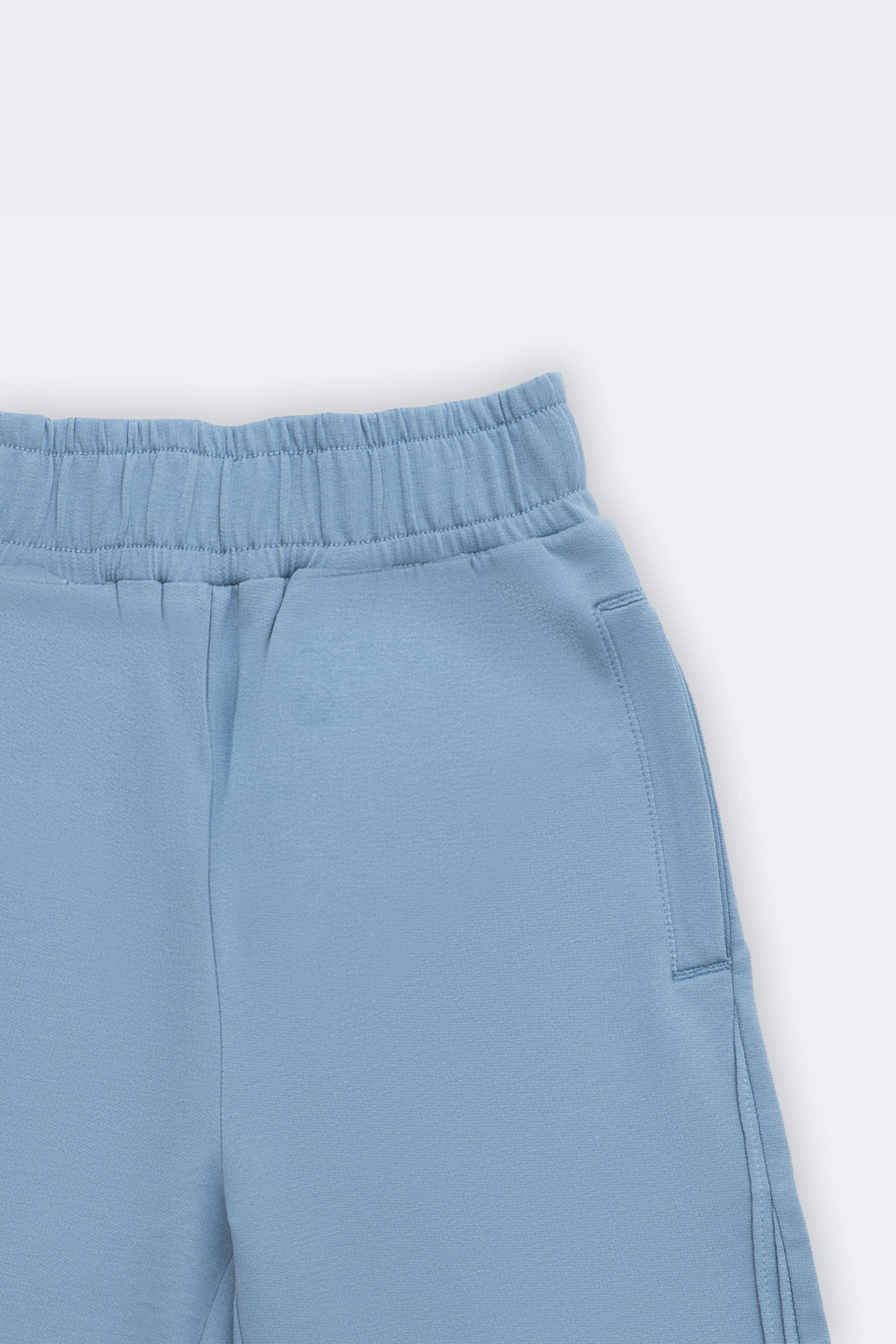 Light blue palazzo pants with elastic waistband and back patch pocket detail