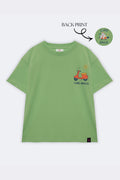 Green kids tee back view with small scooter “CIAO AMICO” print