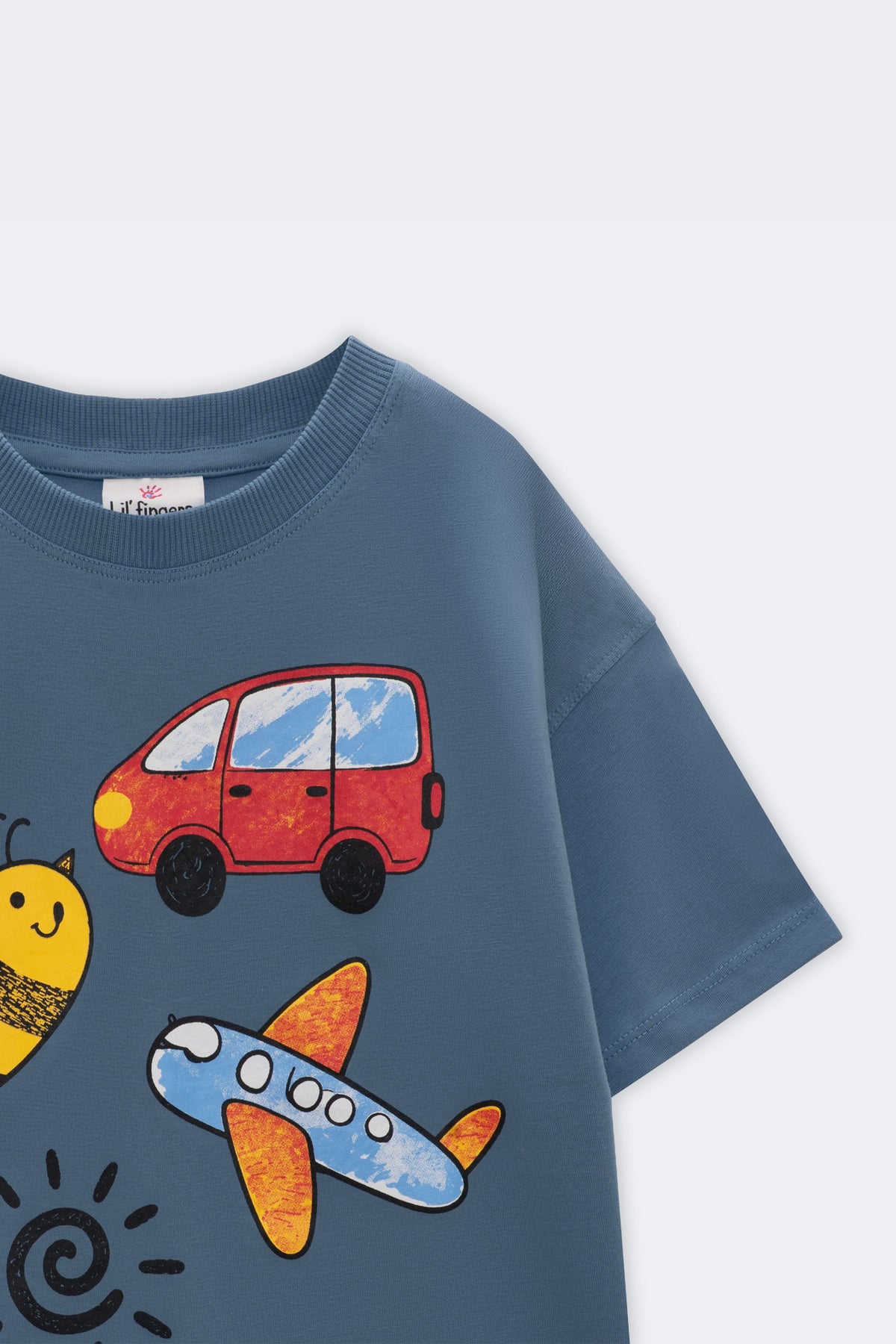 Blue comfort tee close-up with crayon-style red van and plane graphic
