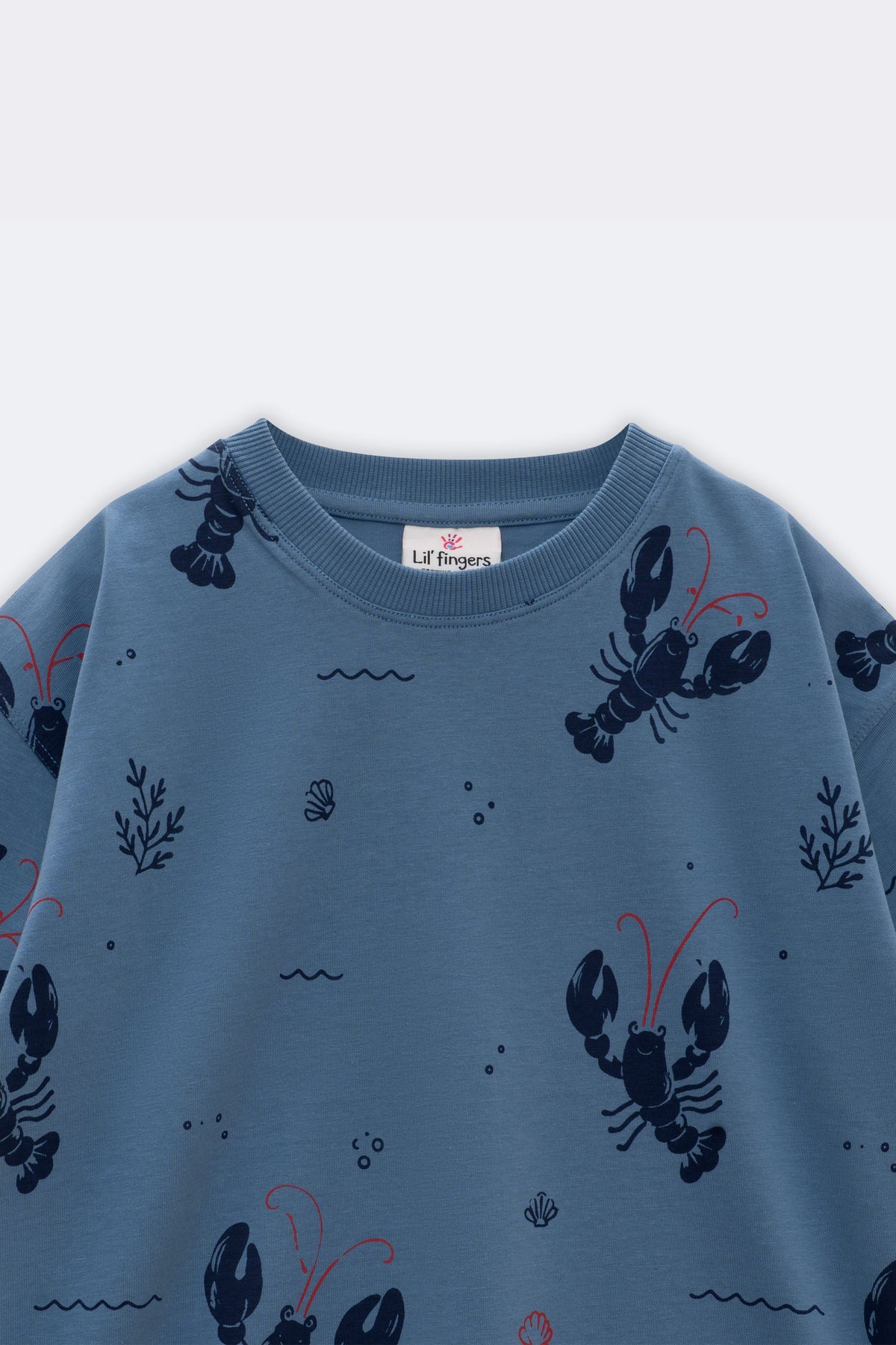 Light blue crew-neck tee with all-over lobster, seaweed, and red accent print