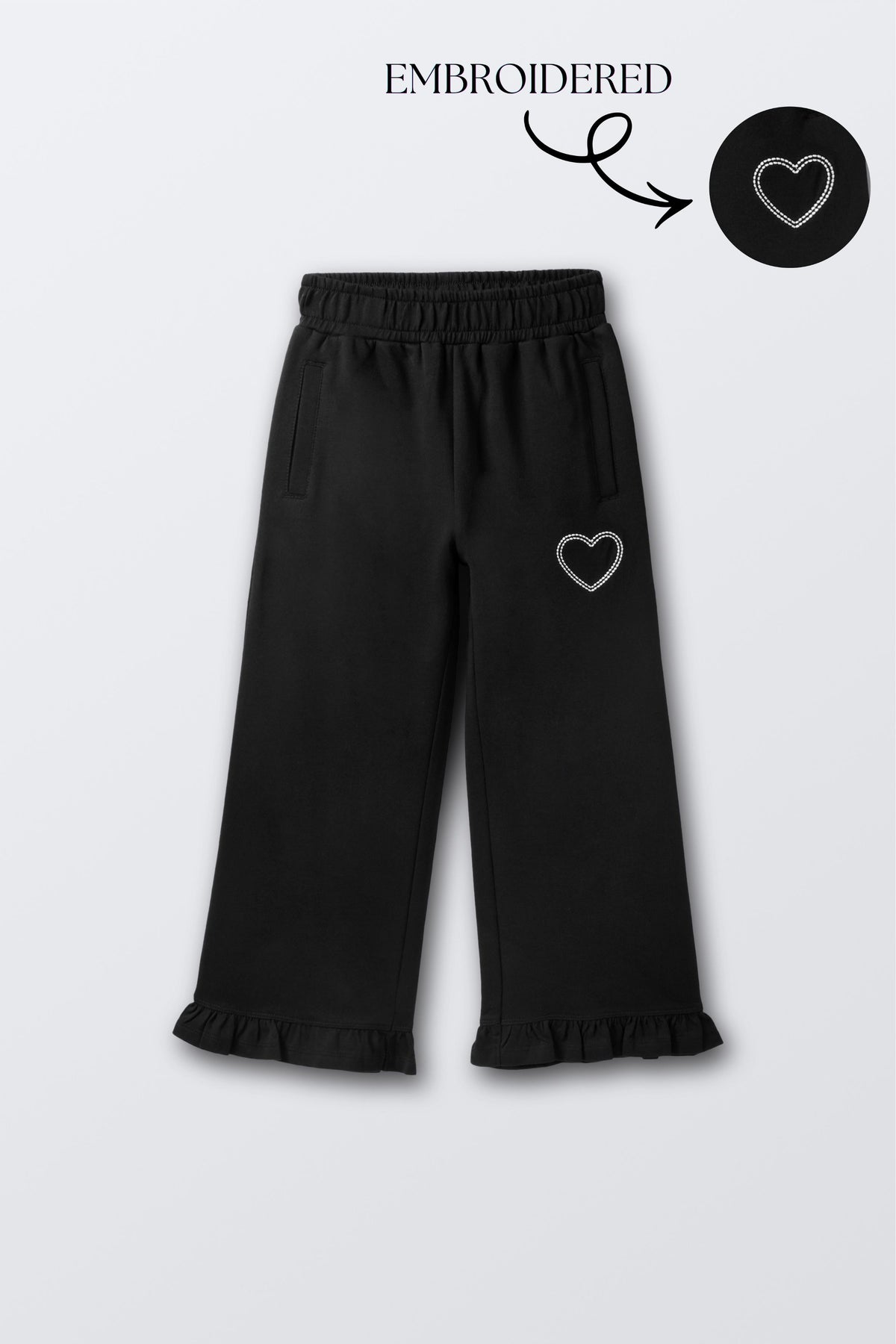 Black flared palazzo pants with small heart embroidery on thigh