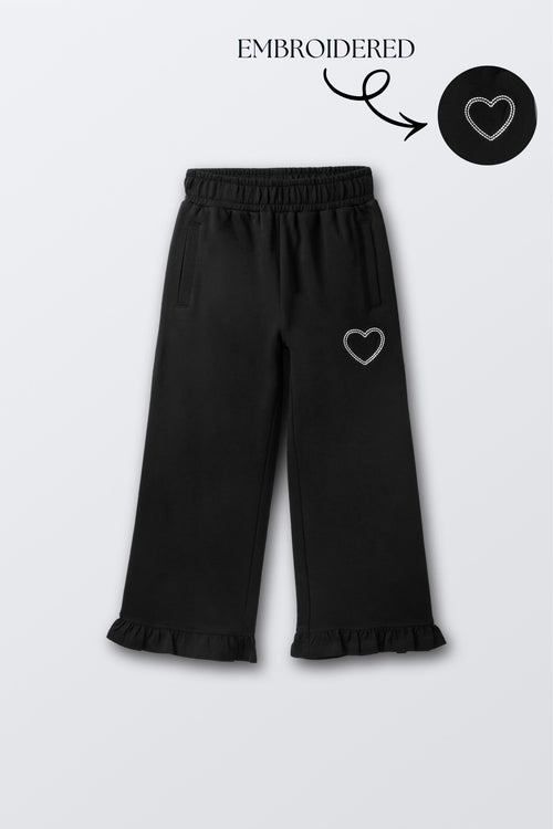 Black flared palazzo pants with small heart embroidery on thigh
