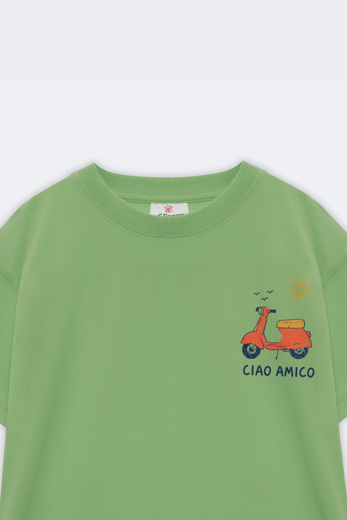 Green kids tee with small scooter and “CIAO AMICO” chest graphic
