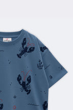 Light blue short-sleeve crew tee with lobsters, waves, and coral accents all over