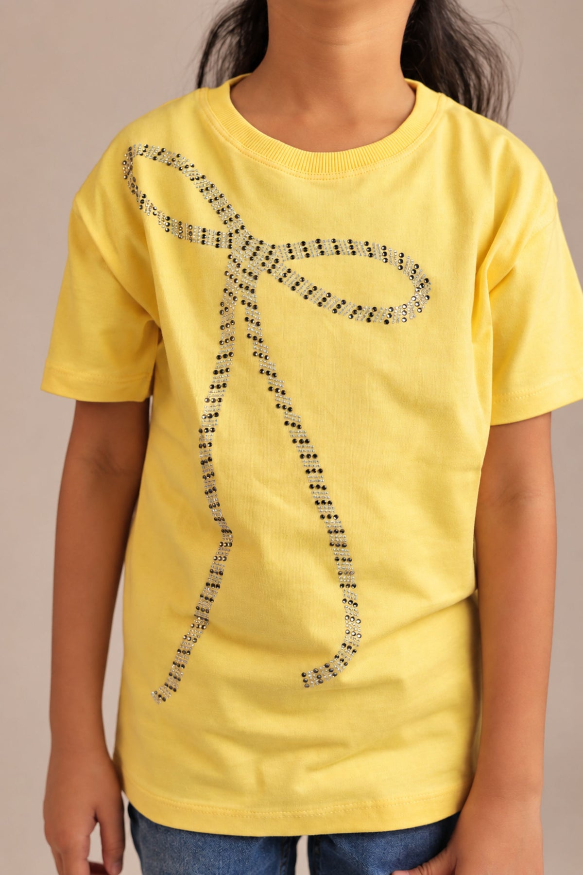 Yellow comfort tee with beaded bow design on chest, short sleeves