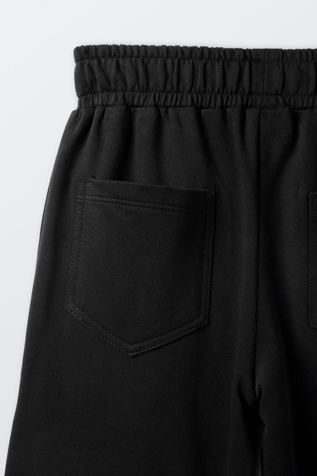 Black palazzo pants fabric with front pocket and stitched seams