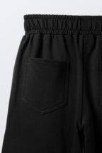 Black palazzo pants fabric with front pocket and stitched seams