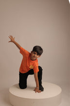 Orange kids' short-sleeve tee with small front 'Sun Shine' graphic