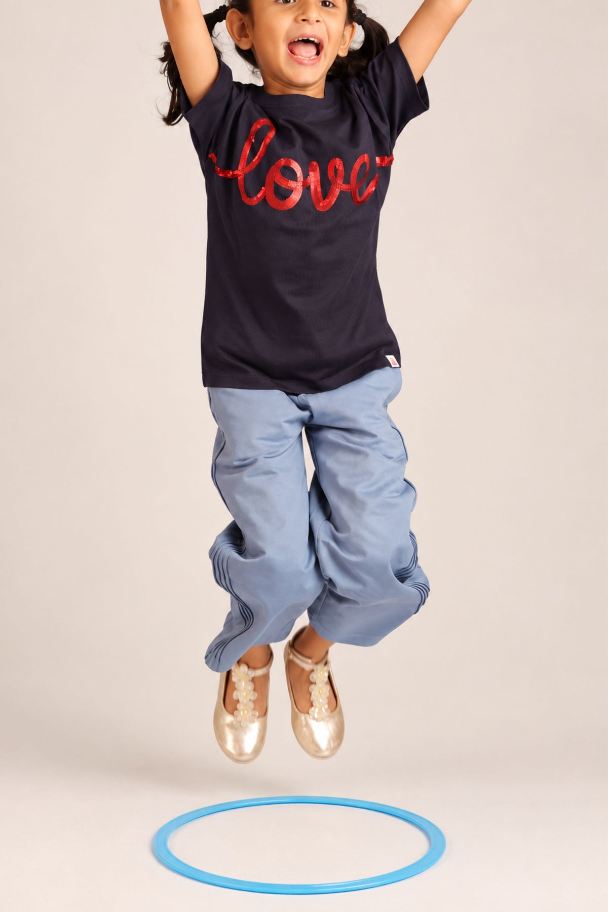 Light blue flared palazzo pants with elastic waistband and slant pintuck detailing