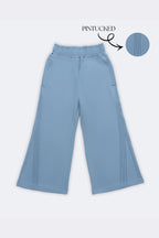 Light blue flared palazzo pants with pintucked vertical side panels