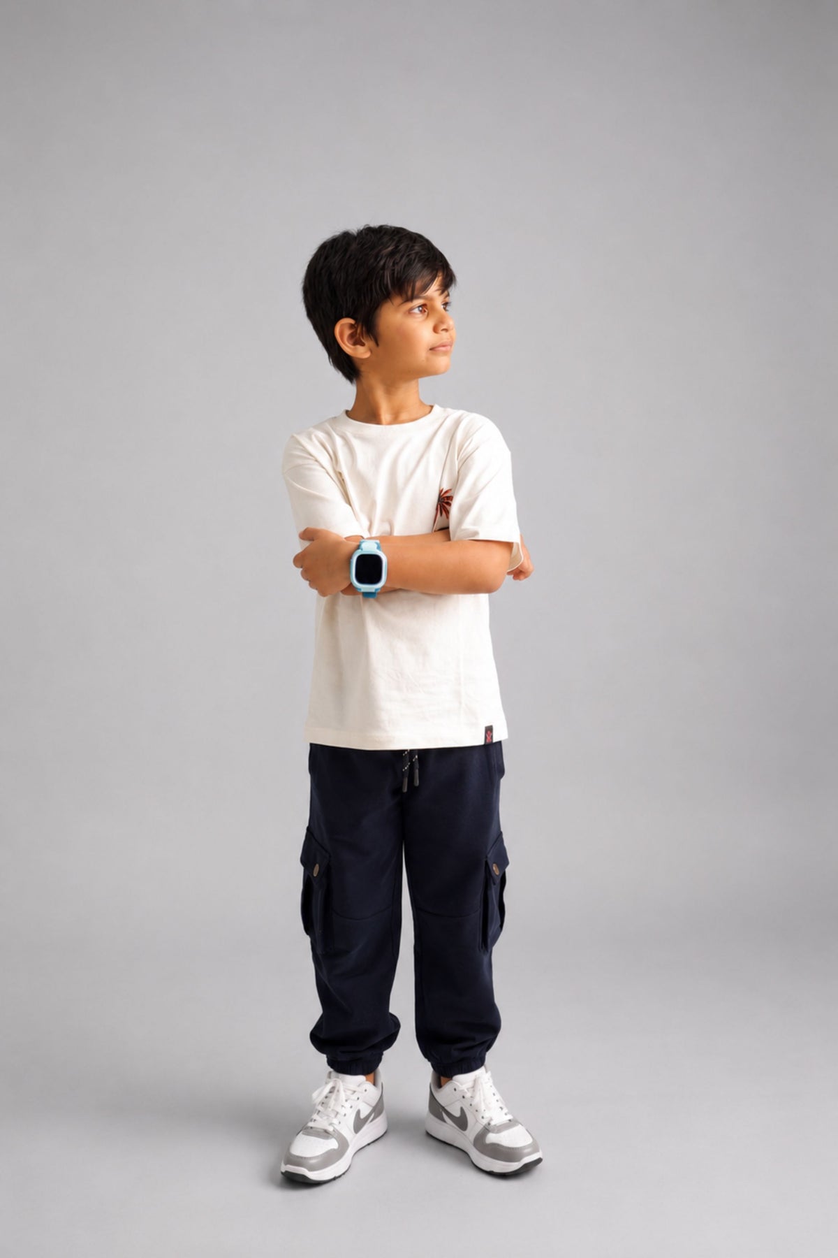 Dark navy cargo pocket joggers worn with sneakers, showing relaxed fit and cuffs