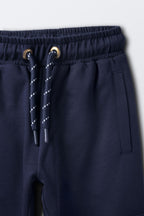 Navy comfort joggers close-up of drawstring and side cargo pocket