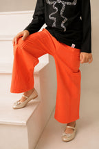 Coral palazzo pants with pintucked pleats and elastic waistband, ankle length