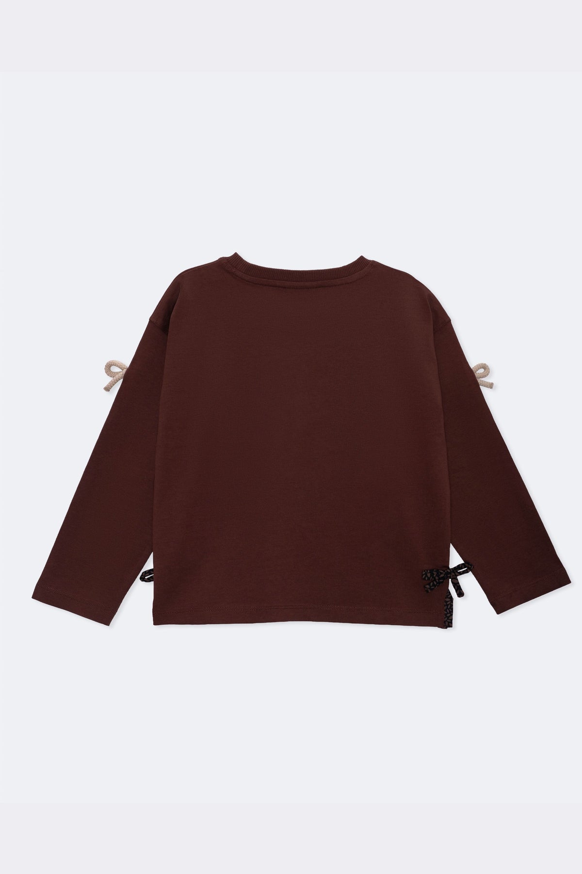 Dark brown boxy long-sleeve tee with beige bow appliques at sleeves and side ties